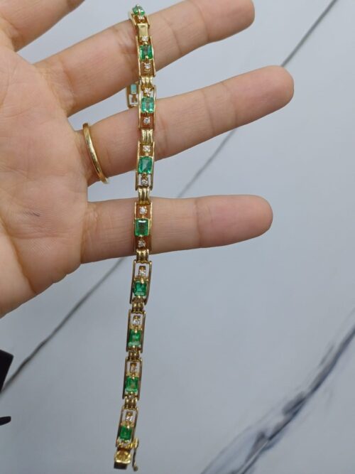 Emerald gold bracelet and precious stones